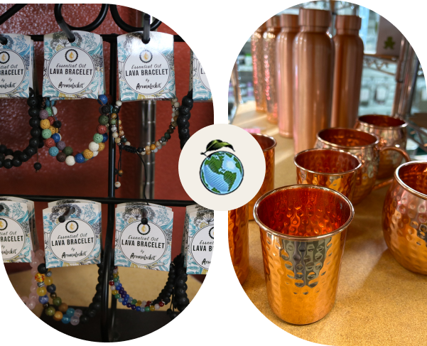 Colorful gemstone earrings and copper drinkware on display at a market stall.